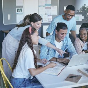 Collaboration, education and learning with students and laptop on project management, teamwork or p